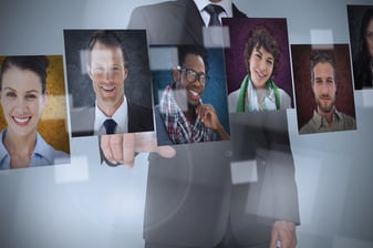 Businessman presenting profile pictures on digital interface