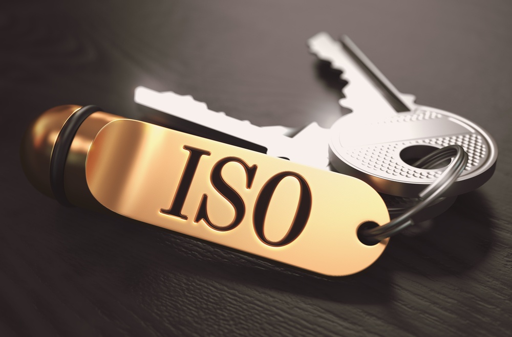 ISO - International Organization for Standardization - Concept. Keys with Golden Keyring on Black Wooden Table. Closeup View, Selective Focus, 3D Render. Toned Image..jpeg